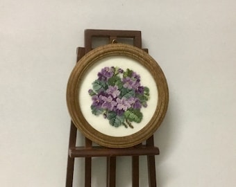 Miniature round picture for dollhouse with violet bouquet embroidered at petit point on silk gauze..