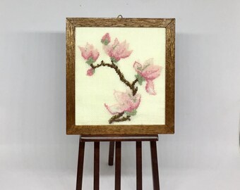 Miniature dollhouse picture frame with flowering magnolia branch embroidered on linen.