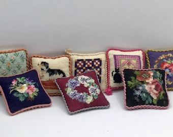 Miniature dollhouse cushion embroidered with petit point on silk gauze with various designs, on sale.