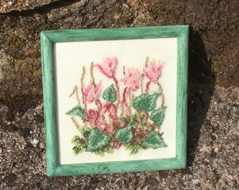 Miniature dollhouse with cyclamen embroidered on silk gauze.