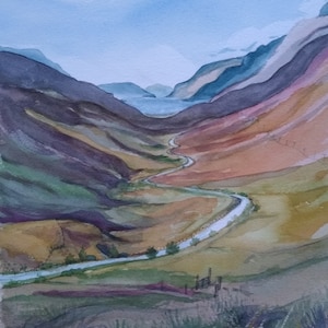 May include: Watercolor painting of a winding road through a mountain valley. The road is light blue and the mountains are a mix of purple, green, and brown.