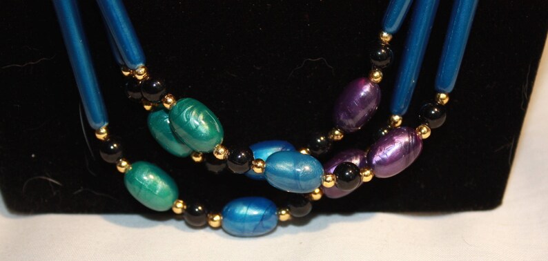 3 Stranded Purple and teal blue peacock colored necklace
