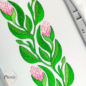 May include: Embroidered design featuring pink flowers and green leaves. The design is on a white fabric background.