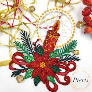 May include: Embroidered Christmas decoration with a red poinsettia, candle, and evergreen. The design includes a white dreamcatcher, red ribbon, and gold accents. The word "Pteris" is in the lower right corner.