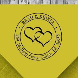 May include: A yellow return address label with a black circle containing two intertwined hearts and the text "BRAD & KRISTA", "269 McBean Pkwy. Chico, PA 36952".