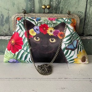 Bolso de mano con marco de bronce y cierre cosido de 8 pulgadas con diseño de gato negro floral tropical