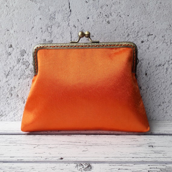 bright orange clutch bag