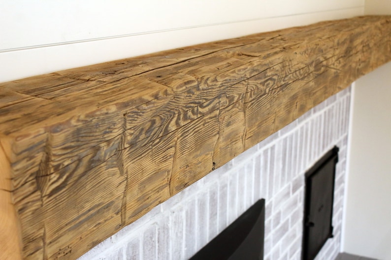 Hand Hewn Beam Floating Fireplace Mantel Shelf. Made from authentic antique reclaimed barn wood beams. Hewn by hand by settlers dating back to the late 1700's!