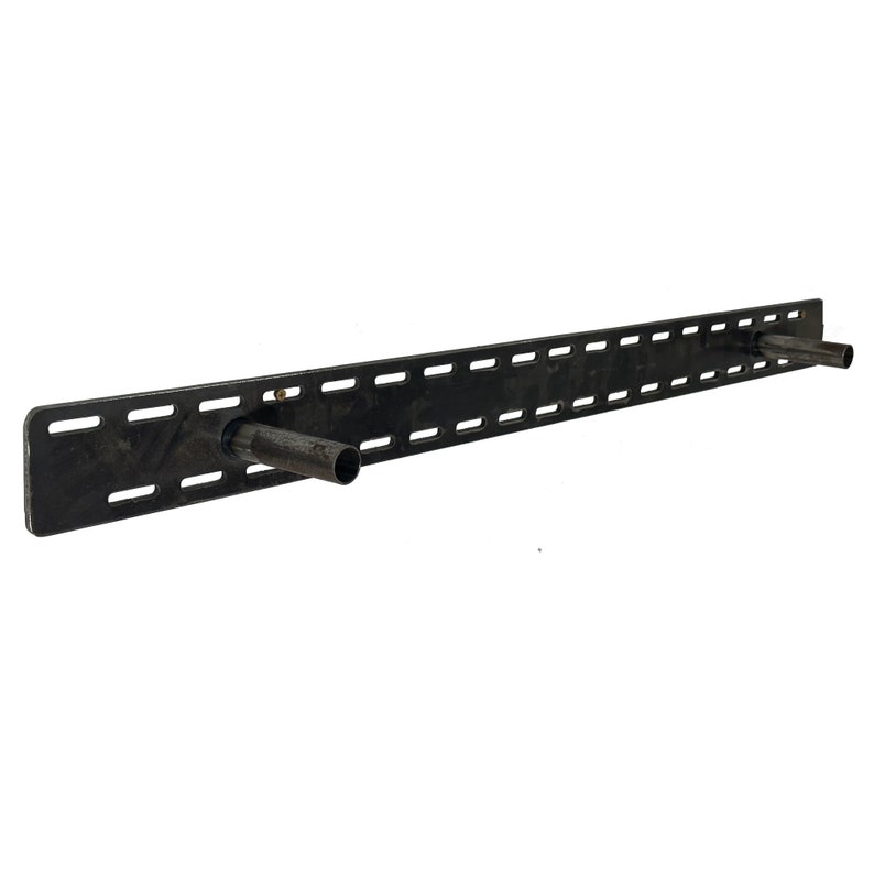 May include: Black metal shelf bracket with multiple holes and two metal brackets extending out from the sides.