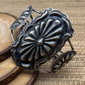 Vintage large repousse native made sterling cuff by C. Yazzie