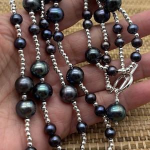 Fresh water peacock pearl long necklace with sterling silver spacer beads.