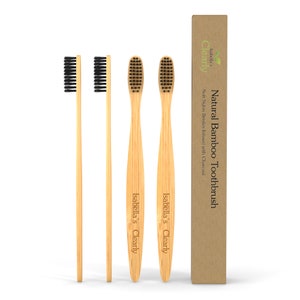 May include: Set of three natural bamboo toothbrushes with charcoal infused bristles. The toothbrushes are packaged in a cardboard box with the text "Isabella's Clearly Natural Bamboo Toothbrush" and "Soft Nylon Bristles Infused with Charcoal".