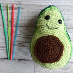 crochet avocado with smiley face