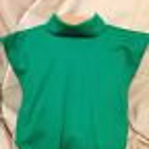 May include: A solid green turtleneck shirt with short sleeves.