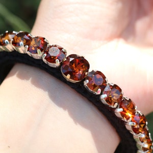 Swarovski crystal statement knitted bracelet for women. Costume Jewellery in browns and cognac whiskey colors.
