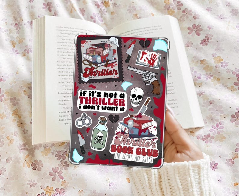 May include: A clear tablet case with a red and black design featuring the word "Thriller" and various illustrations. The case includes images of a skull, a revolver, knives, and the text "If it's not a thriller I don't want it."