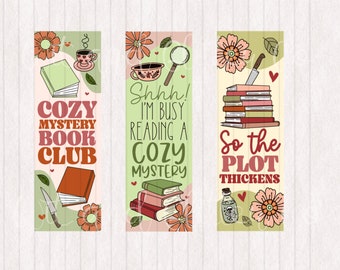 May include: Three bookmarks with illustrations of books, teacups, magnifying glasses, and knives. The text on the bookmarks reads "Cozy Mystery Book Club", "Shhh! I'm busy reading a Cozy Mystery", and "So the Plot Thickens".