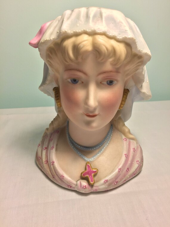 antique doll head vases