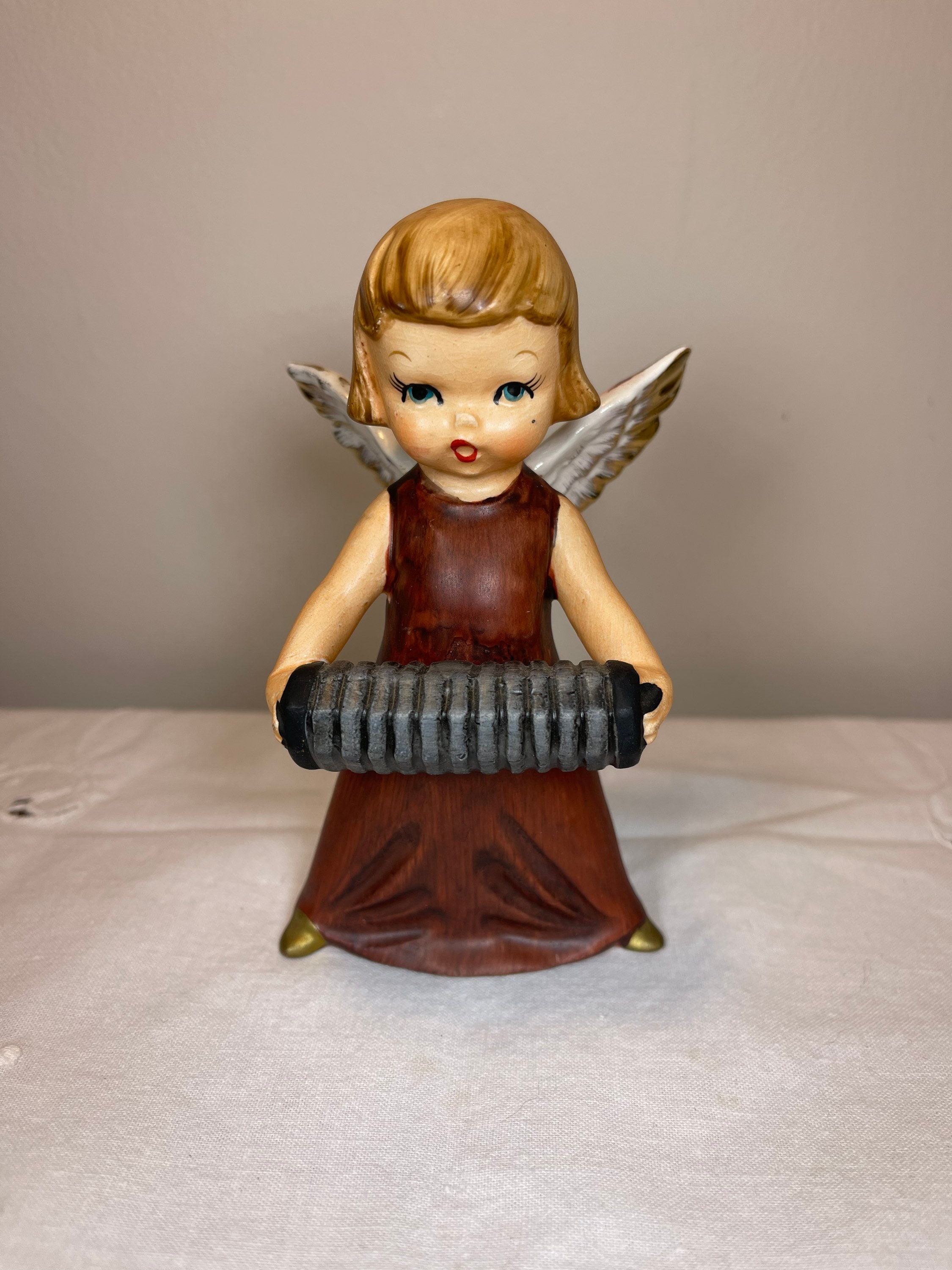 Vintage Wales ceramic brown angel playing accordion-mid Vintage Wales ceramic brown angel playing accordion-mid