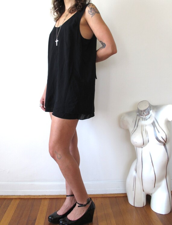 sheer black sleeveless top