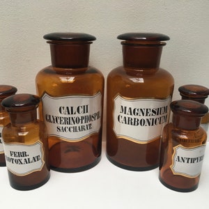 VINTAGE PHARMACY BOTTLES - Set of 6 amber apothecary bottles with glass toppers and painted labels from Germany circa 1930
