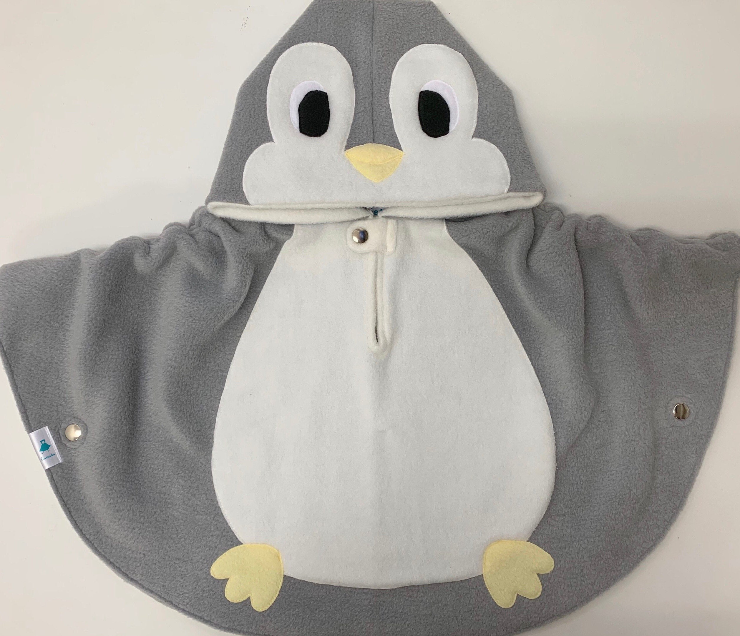 PRIX FOUS Poncho enfant 75x75cm en coton bleu marine pingouin