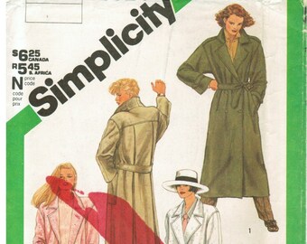 May include: A sewing pattern for three different coats. The pattern is for a long, double-breasted coat with a belt. The pattern is from Simplicity and the pattern number is 6524.