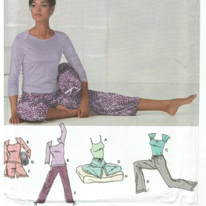 May include: A sewing pattern for pyjamas with a purple and white animal print design. The pattern includes instructions for making a top, trousers, and a pillow. The pattern is for sizes 12, 14, 16, and 18. The pattern is from Simplicity @ Home.
