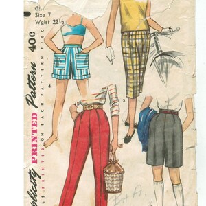 May include: Vintage Simplicity printed pattern for girls' clothing, size 7, with a 57 cm waist. The illustration shows various outfits, including shorts, trousers, and a top. The pattern is marked "40c" and includes details printed on each pattern piece.