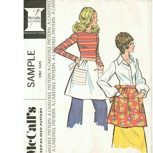 May include: A sewing pattern for a short apron with two pockets. The pattern is for misses' and junior sizes. The pattern is a sample and is one size. The pattern is a step-by-step pattern and is a carefree pattern.