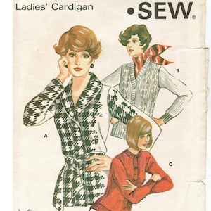 May include: A sewing pattern for a cardigan with three different styles. The pattern is called "Kwik Sew" and the pattern number is 504. The pattern is available in sizes S, M, L, and XL. The price of the pattern is $1.50 in the U.S., $4.80 in Canada, and $2.10 in Australia.
