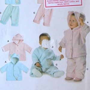 May include: Burda sewing pattern number 9735 for making baby clothes. The pattern includes instructions for a hooded jacket, a long-sleeved shirt, and trousers. The pattern is available in sizes 3M, 6M, 9M, 12M, and 18M.