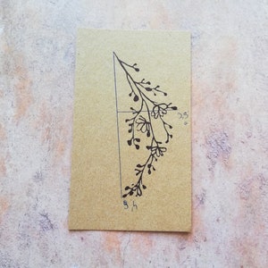 May include: A black and white line drawing of a branch with leaves and berries on a brown cardstock background. The cardstock is marked with measurements of 3.5 inches and 5 inches.