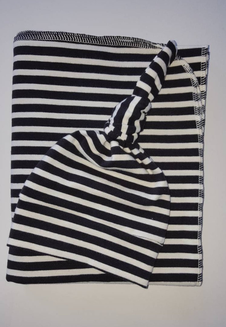 cream swaddle blanket
