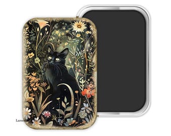 May include: A rectangular magnet featuring a black cat sitting amidst colorful flowers and foliage. The cat has yellow eyes and a long tail. The magnet has a silver border and a black magnetic backing. The design is a whimsical illustration.