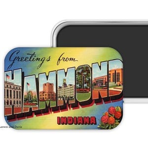 May include: A rectangular magnet featuring a vintage postcard design. The magnet reads "Greetings from Hammond Indiana" in large, colorful letters. The design includes images of buildings and flowers, with a gradient blue and yellow background.