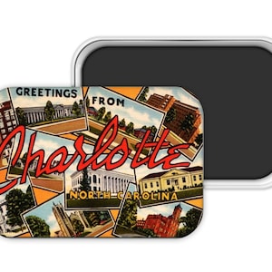 May include: A rectangular magnet featuring a vintage postcard design with the words "Greetings from Charlotte, North Carolina" in red script. The magnet showcases various buildings and landmarks in a collage style, with a silver border.