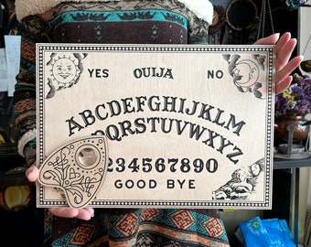 Classic Ouija Board black letters. Wooden Board for talking with spirits