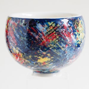 Russell Akerman Ceramic Art hand thrown studio pottery tea bowl. Painted by Russell in an abstract multicolour slipware design. image 1