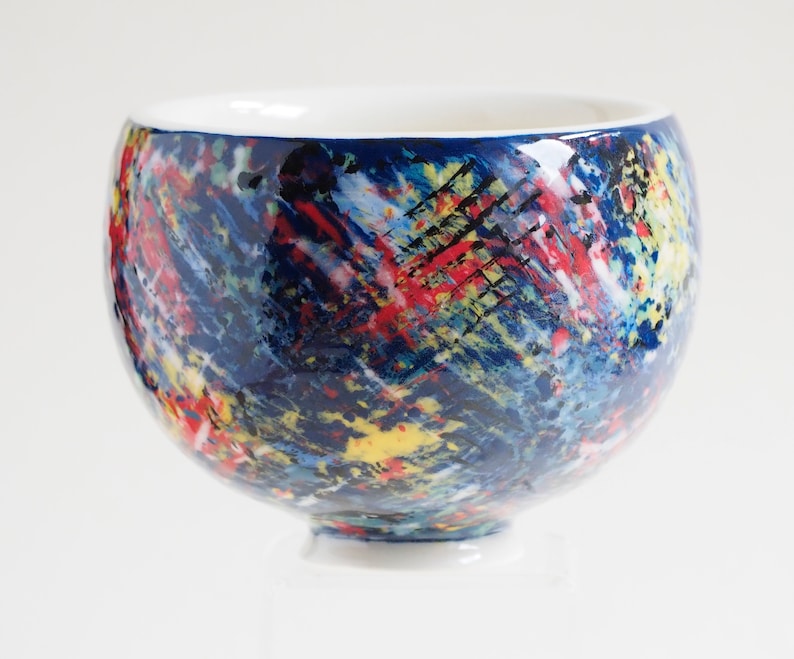 Russell Akerman Ceramic Art hand thrown studio pottery tea bowl. Painted by Russell in an abstract multicolour slipware design. image 1