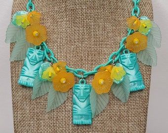 Tiki Necklace with Vintage Tikis, Tropical Flowers, and Leaves in Orange and Aqua. Luau 50s, 60s Retro Pinup Bakelite Lucite MCM Kitschy