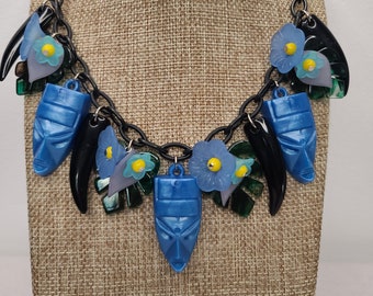 Creepy Tiki Necklace with Vintage Tikis, Claws, Tropical Flowers and Leaves in Blue. Luau 50s, 60s Retro Pinup Style MCM Jungle Princess