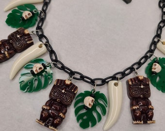 Witch Doctor Tiki Necklace with Tikis, Skulls, Monstera Leaves, and Claws. Luau 50s, 60s Retro Pinup MCM Jungle Princess Lucite Bakelite