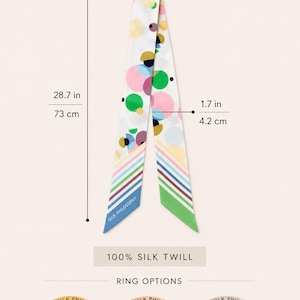 May include: A silk twill bracelet with a multicolored circular pattern, measuring 28.7 inches long and 1.7 inches wide. It includes three ring options labeled Silk Philosophy: gold plated, rose gold plated, and stainless steel.