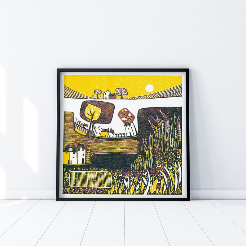 May include: A yellow, brown, and purple linocut print of a rural landscape with houses, trees, and a field of flowers. The sun is shining in the sky.