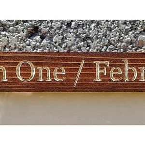 May include: A wooden plaque with the inscription "Jim's Hole In One / February 8, 2014".