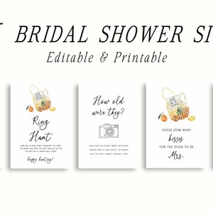 May include: Five printable bridal shower signs with a watercolor illustration of a basket of lemons and oranges. The signs include "Cards & Gifts", "Ring Hunt", "How old were they?", "Guess how many kisses for the soon to be Mrs.", and "Custom Sign, add your own text".