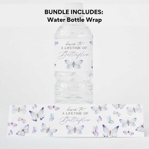 May include: Water bottle wrap with a purple and white butterfly design. The wrap has the text "Here's to a lifetime of butterflies".