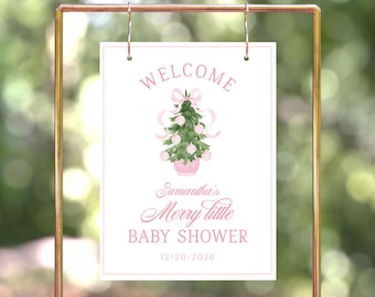 May include: A white welcome sign with a pink Christmas tree illustration and the text "Welcome", "Samantha's Merry Little Baby Shower", and "12/20/2026".