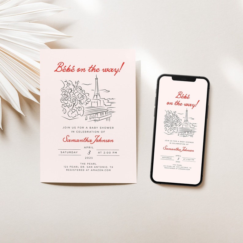 Op de afbeelding: Een roze babyborrel uitnodiging met een zwart-witte illustratie van de Eiffeltoren en bloemen. De tekst luidt "B&eacute;b&eacute; on the way!" en bevat de datum, tijd en locatie van het evenement. De uitnodiging bevat ook de naam "Samantha Johnson" en de tekst "Registered at Amazon.com".
